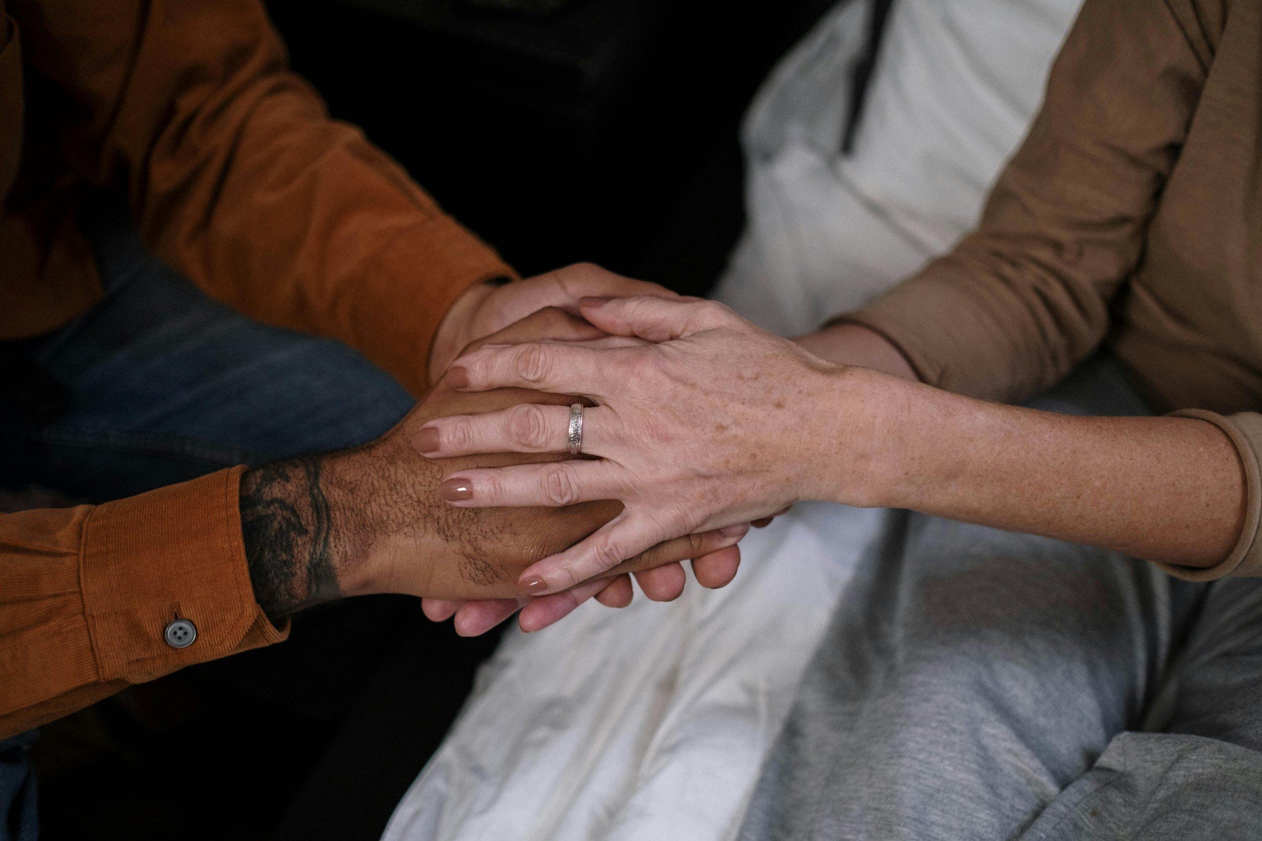 2 sets of hands - holding hands