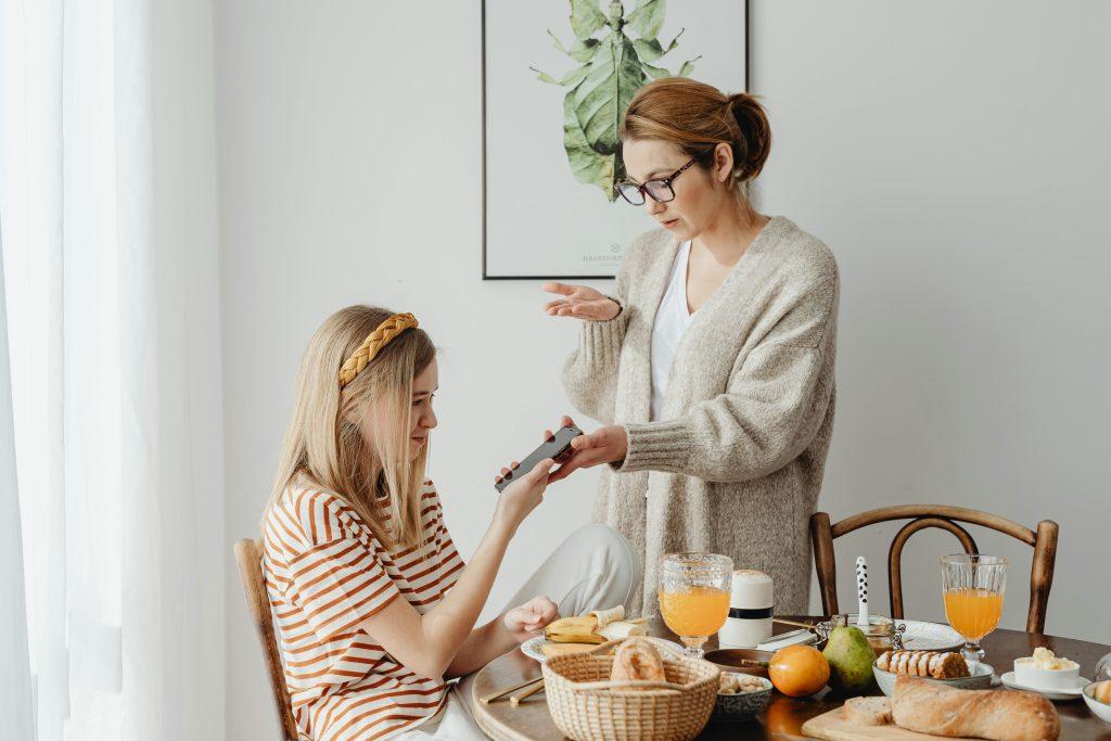 Mom and daughter arguing over phone usage