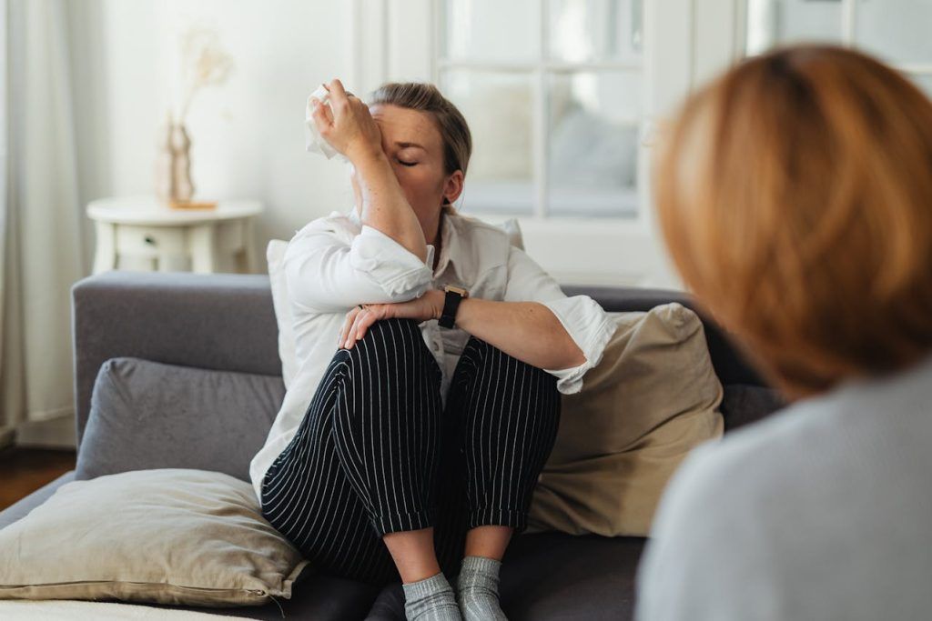 Female client crying with female therapist