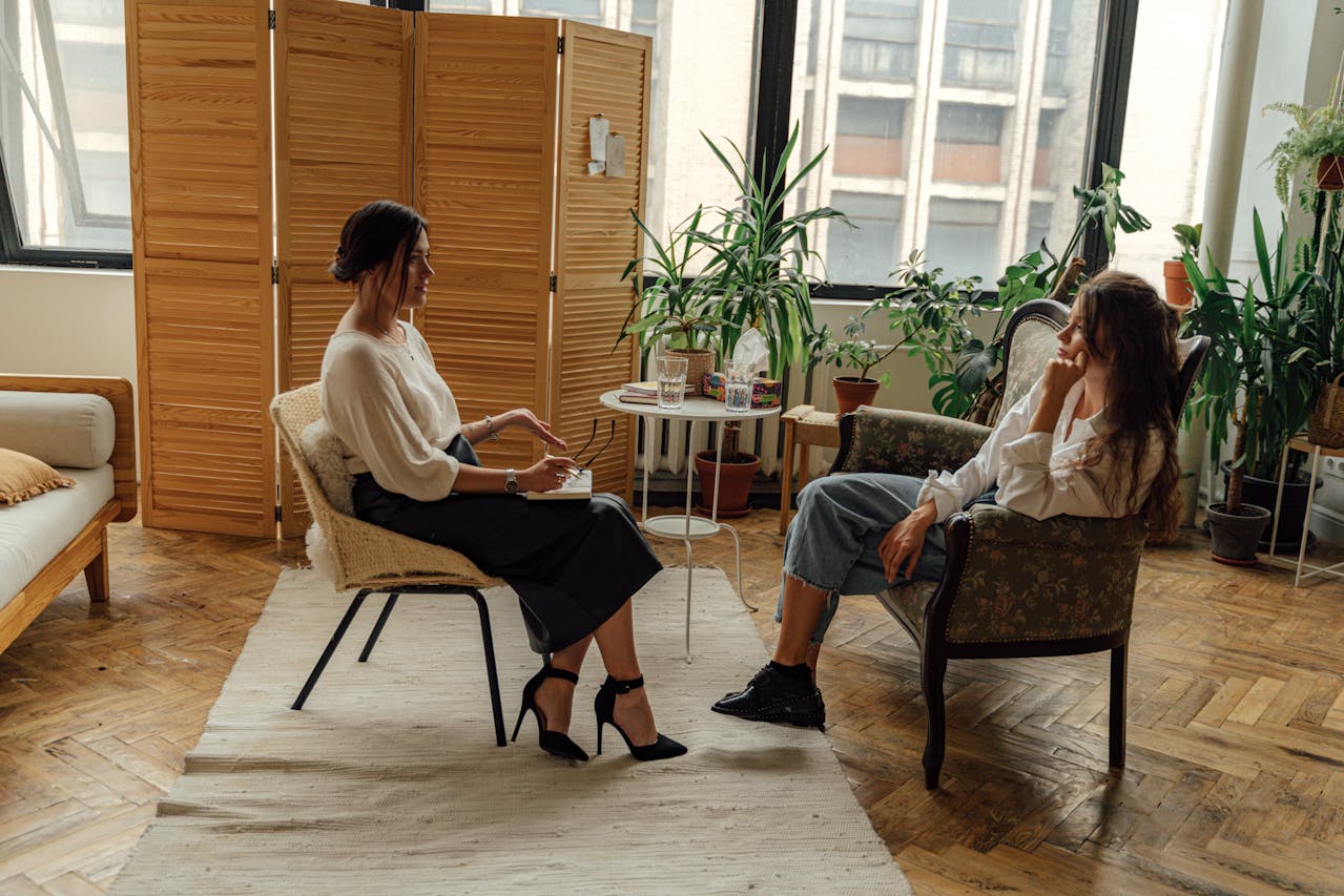 therapist with a female client sitting across from her