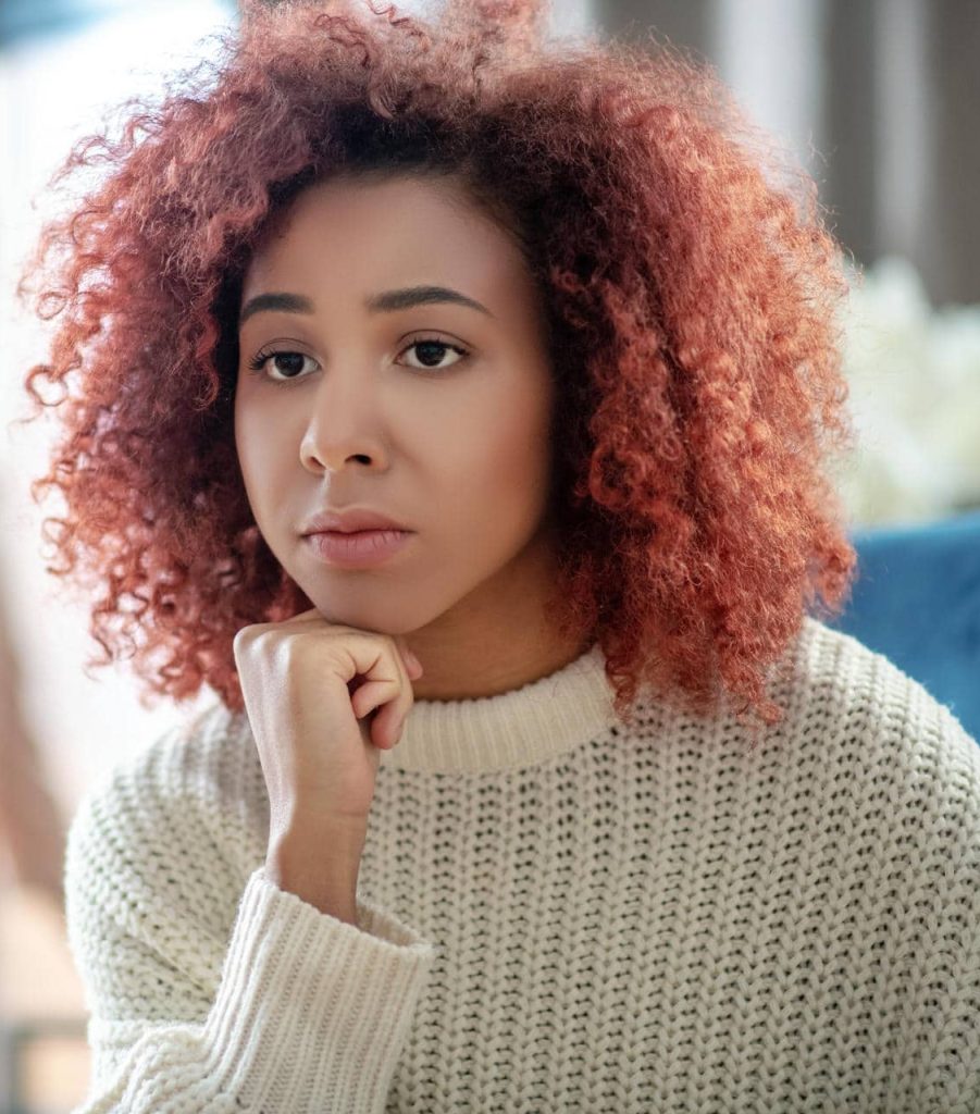 Woman looking sad - dealing with grief and loss