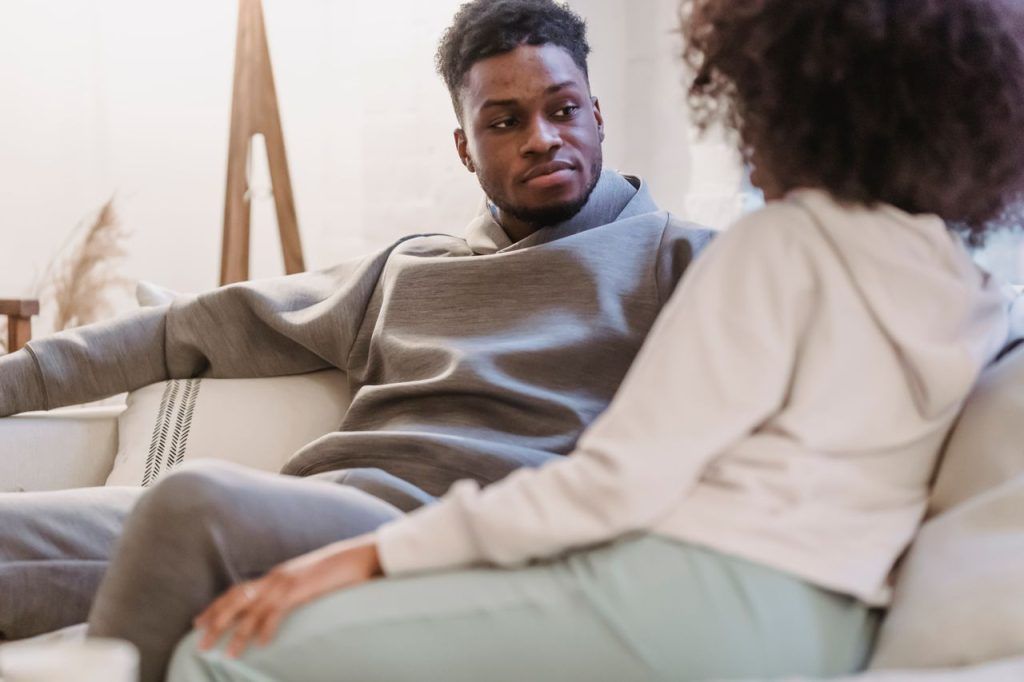 Couple sitting side by side in therapist office