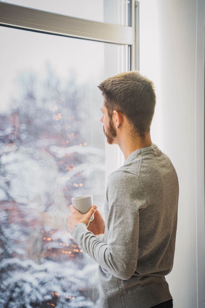Man looking out of a window